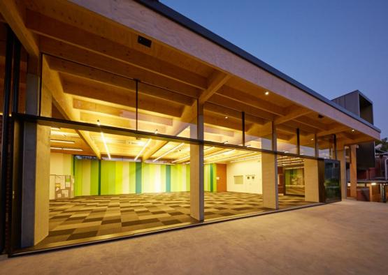 a building with glass walls and a green and black checkered floor