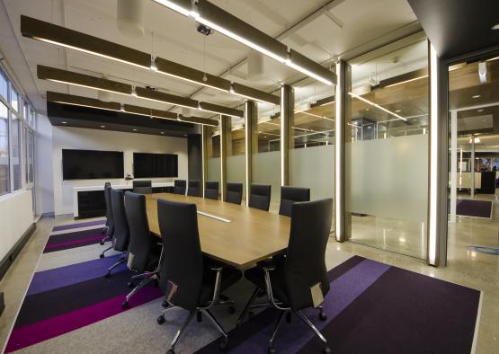 a conference room with a table and chairs