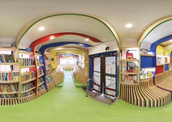 a room with colorful shelves and chairs