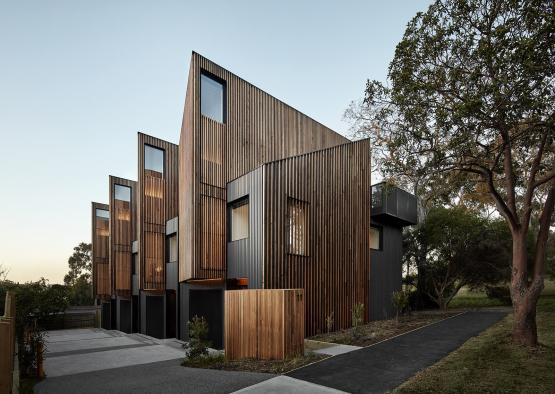 a building with a wood paneled roof