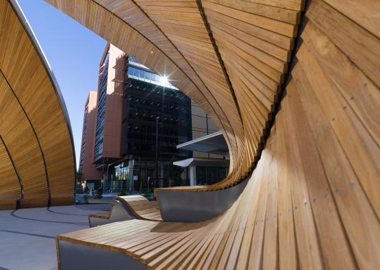 a wooden benches in a city