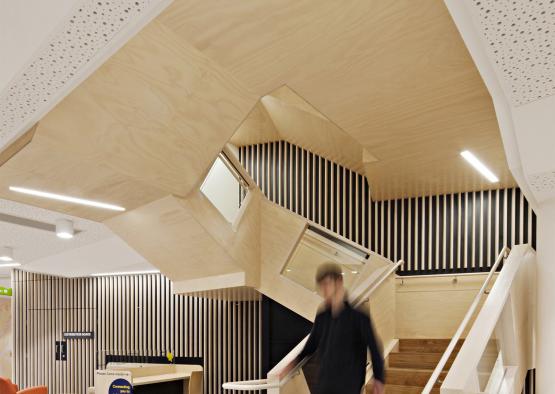 a person walking up stairs in a building