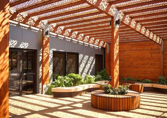 a wooden structure with a pergola