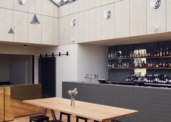 a bar with a table and stools