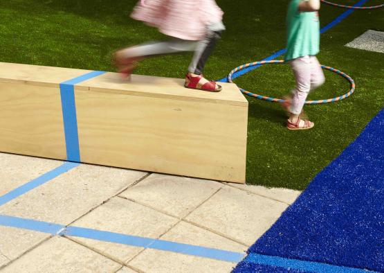 a group of kids playing in a playground