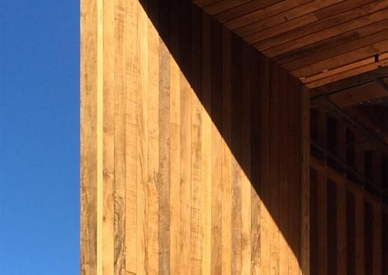 a wood wall with a blue sky