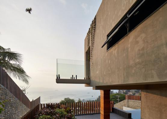 a building with a balcony and a view of the ocean