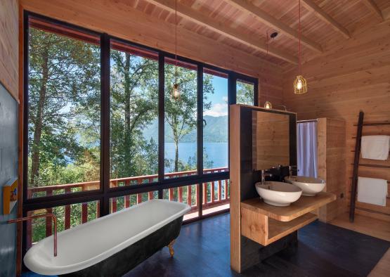 a bathroom with a tub and sinks