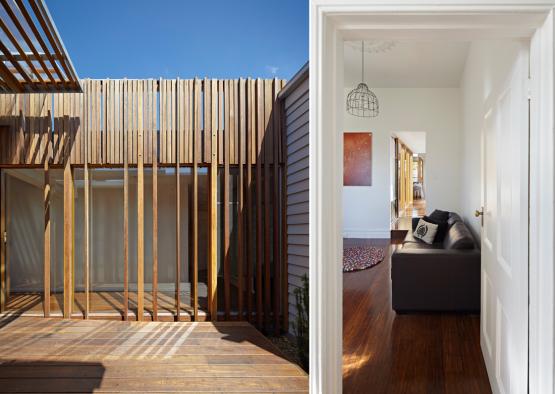 a room with a wood wall and a couch