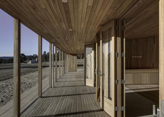 a wooden building with a wood deck and a wood floor