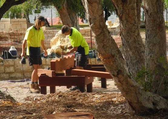 a group of men working outside