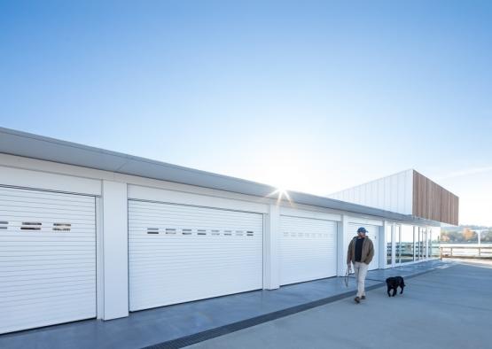 a man and dog outside of a building