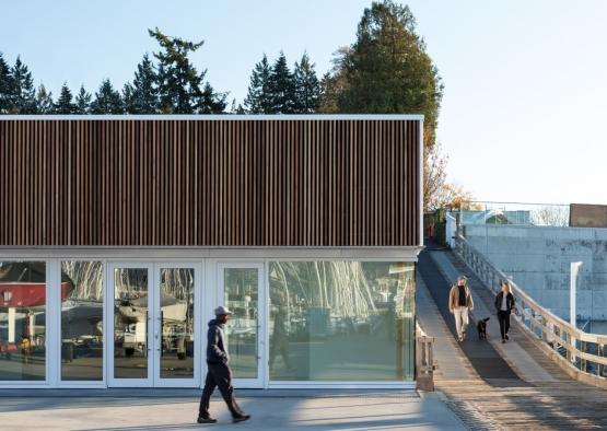 a group of people walking by a building