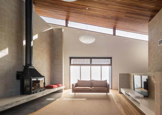 a living room with a fireplace and a couch