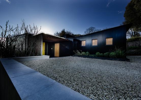 a building with gravel and a walkway