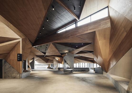 a large room with a triangular ceiling