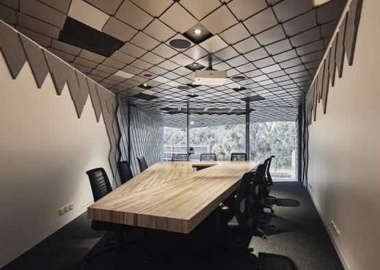 a conference room with a table and chairs