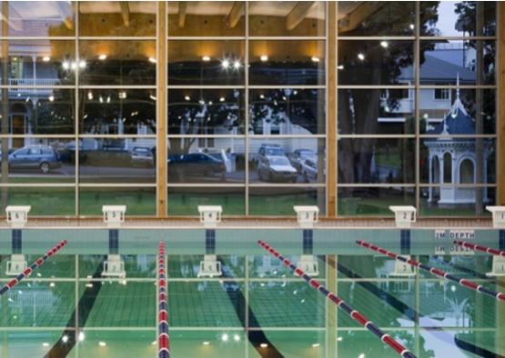 a indoor swimming pool with a large window