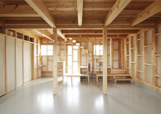 a room with wooden beams and stairs