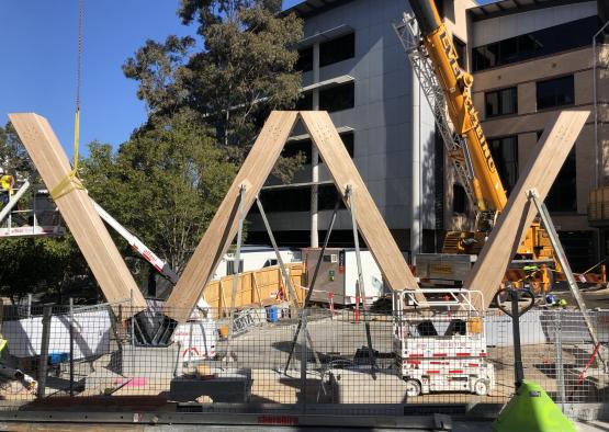 a construction site with a crane and a building