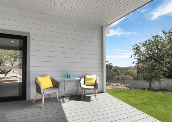 a patio with chairs and table