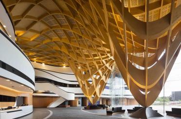 a large building with a large ceiling and stairs