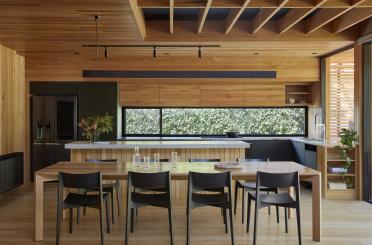 a dining table and chairs in a room