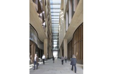 a group of people walking in a building