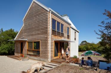 a house with a couple of people and a dog